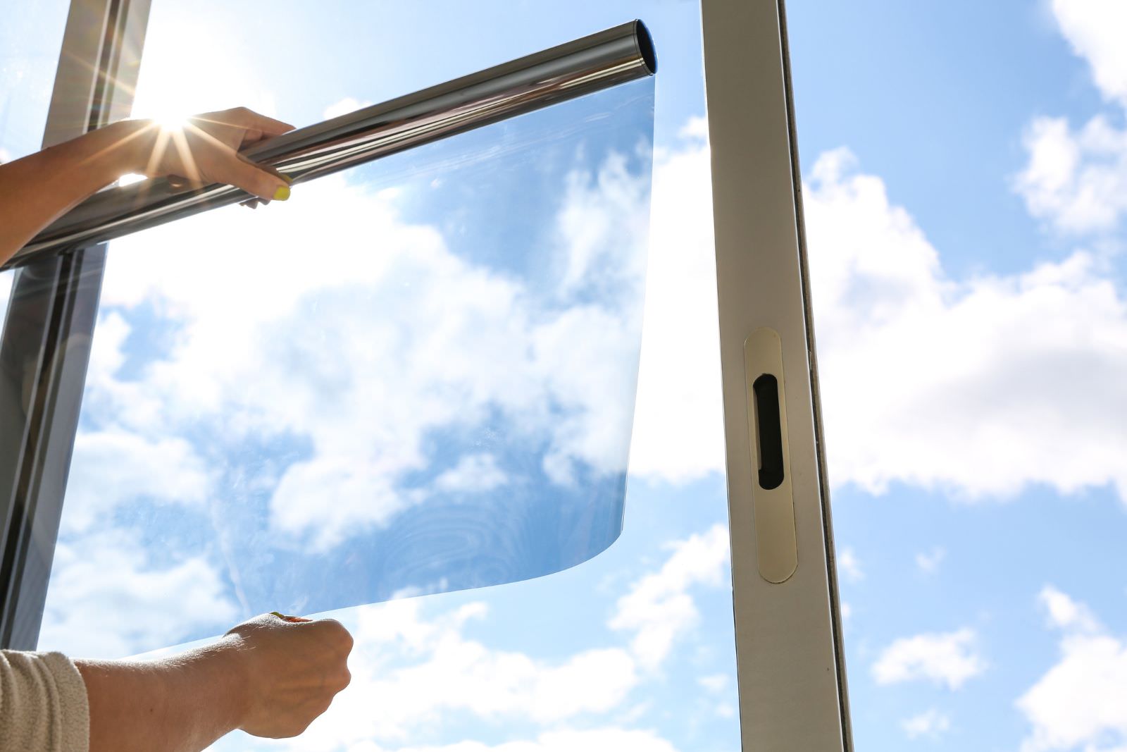 applying window tinting to a large business window